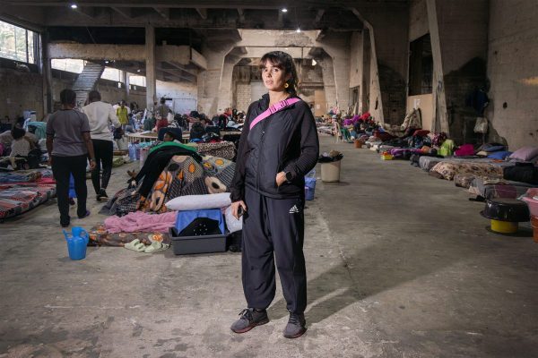 Lea Ghorayeb, 36, stands surrounded by almost 200 women from Sierra Leone working as migrant domestic workers in Lebanon, who have been abandoned by their sponsors and displaced by the ongoing war. She has been dedicating all her time to help this community, volunteering at The Shelter, the once-exhibition salon transformed into a temporary refuge. "My activism is about standing by my community, reclaiming hope, and refusing to let despair define us. Through it all, the women arrived at The Shelter feeling scared and broken, but they left with smiles, a renewed sense of dignity, and the tools to move forward. That transformation remains one of my greatest joys"