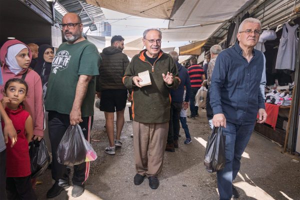 Jamil Qasim in the middle of Beirut’s busy flea market, the Souq El-Ahad, where war is but a mirage, and life seems to proceed undisturbed."Art belongs to the people. I come here to the market to help make it available to most, at a low price. You wouldn’t believe how many customers are interested in art and literature books, despite the hard times we are facing"